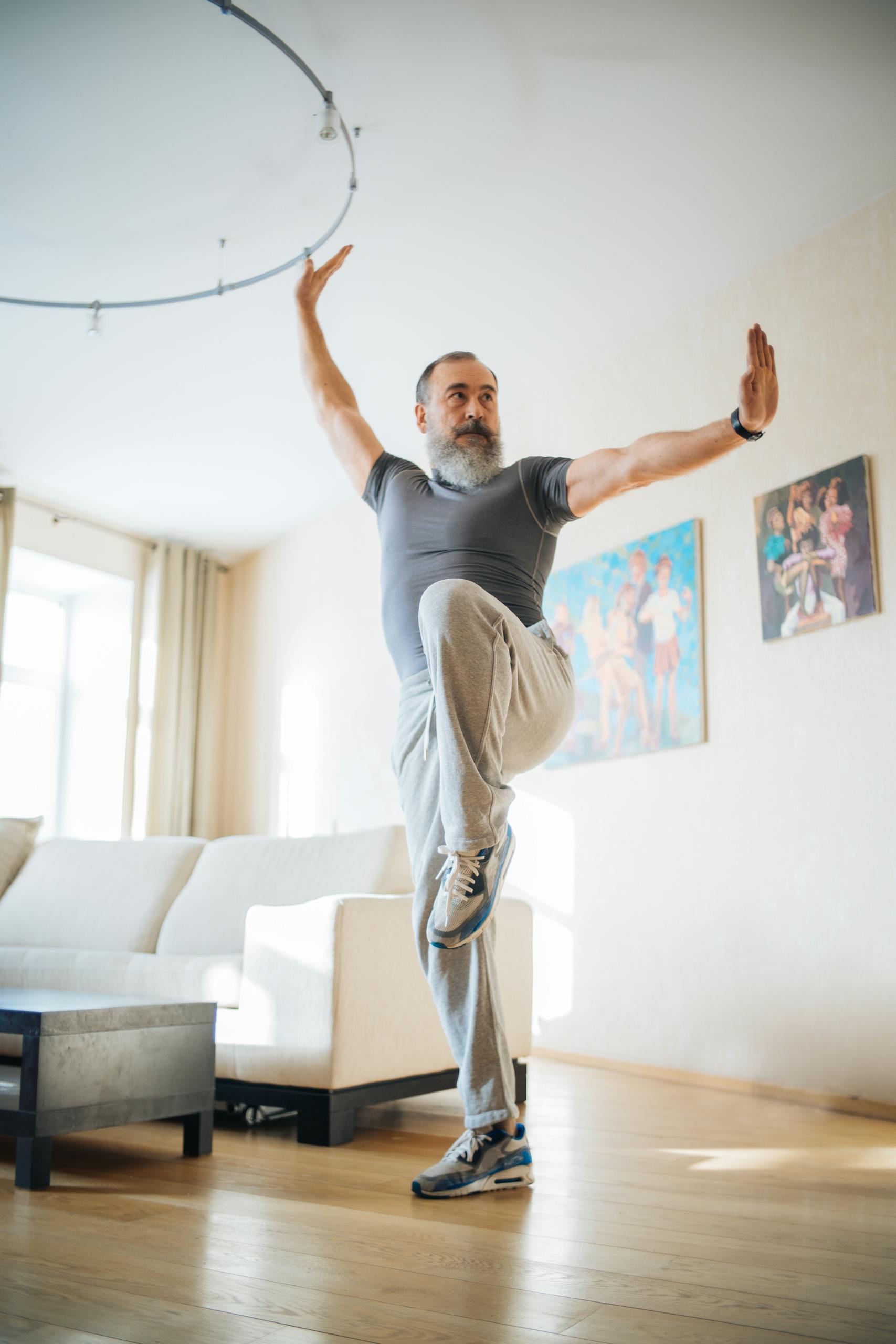 Senior man engaging in fitness routine indoors, promoting wellness and healthy living.